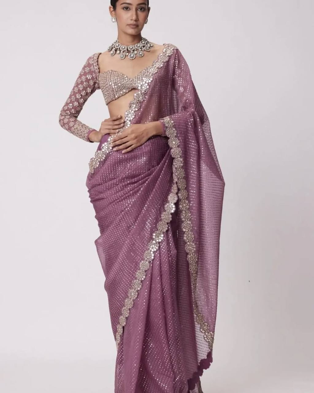 Faux Georgette Saree featuring a beautifully embroidered body adorned with sparkling 5mm sequins