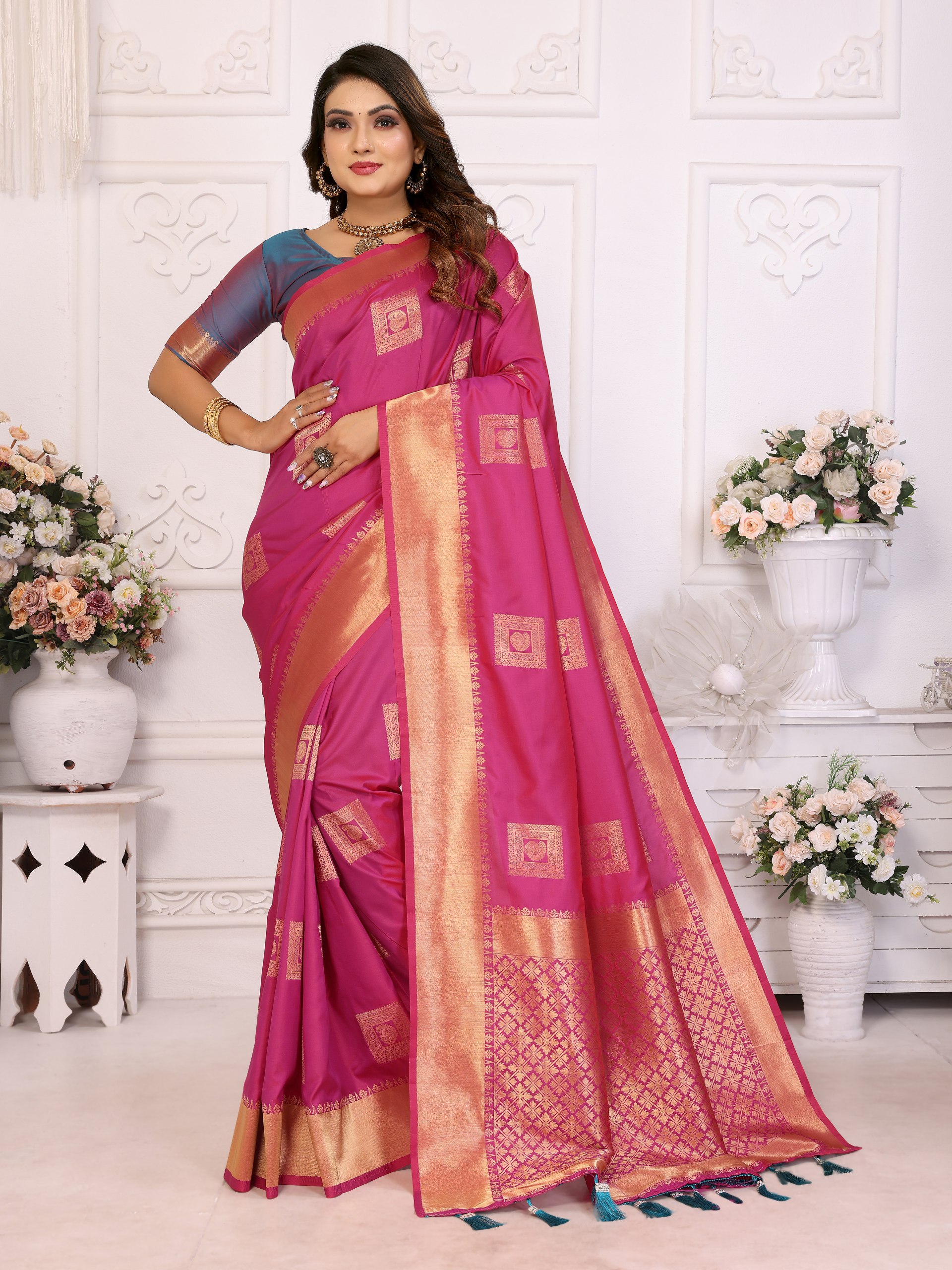 Soft Silk Saree featuring an elegant woven Butta motif embellishing the body