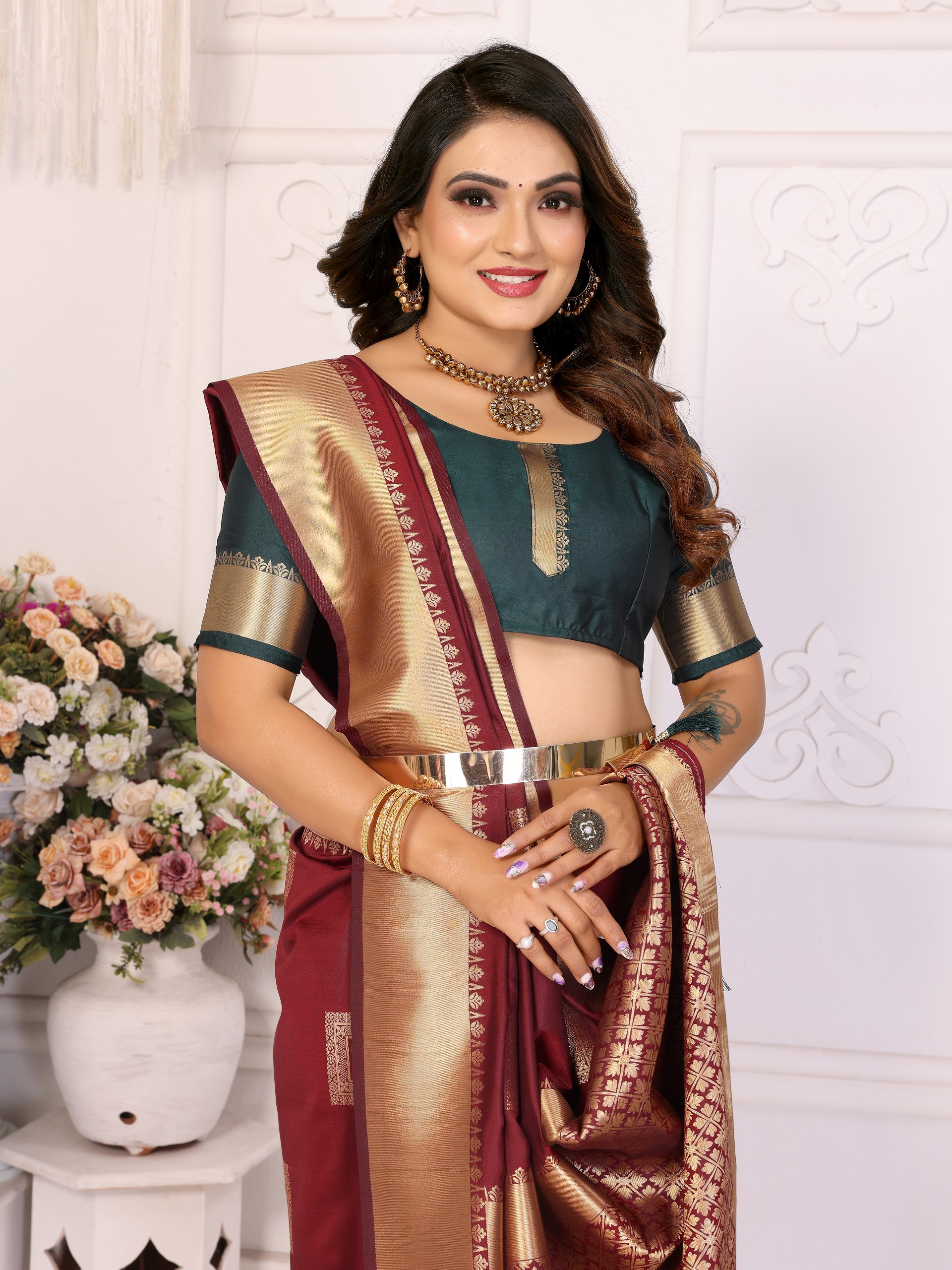 Soft Silk Saree featuring an elegant woven Butta motif embellishing the body