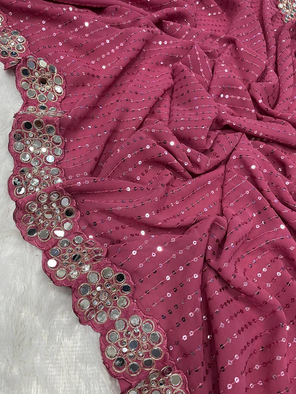 Faux Georgette Saree featuring a beautifully embroidered body adorned with sparkling 5mm sequins