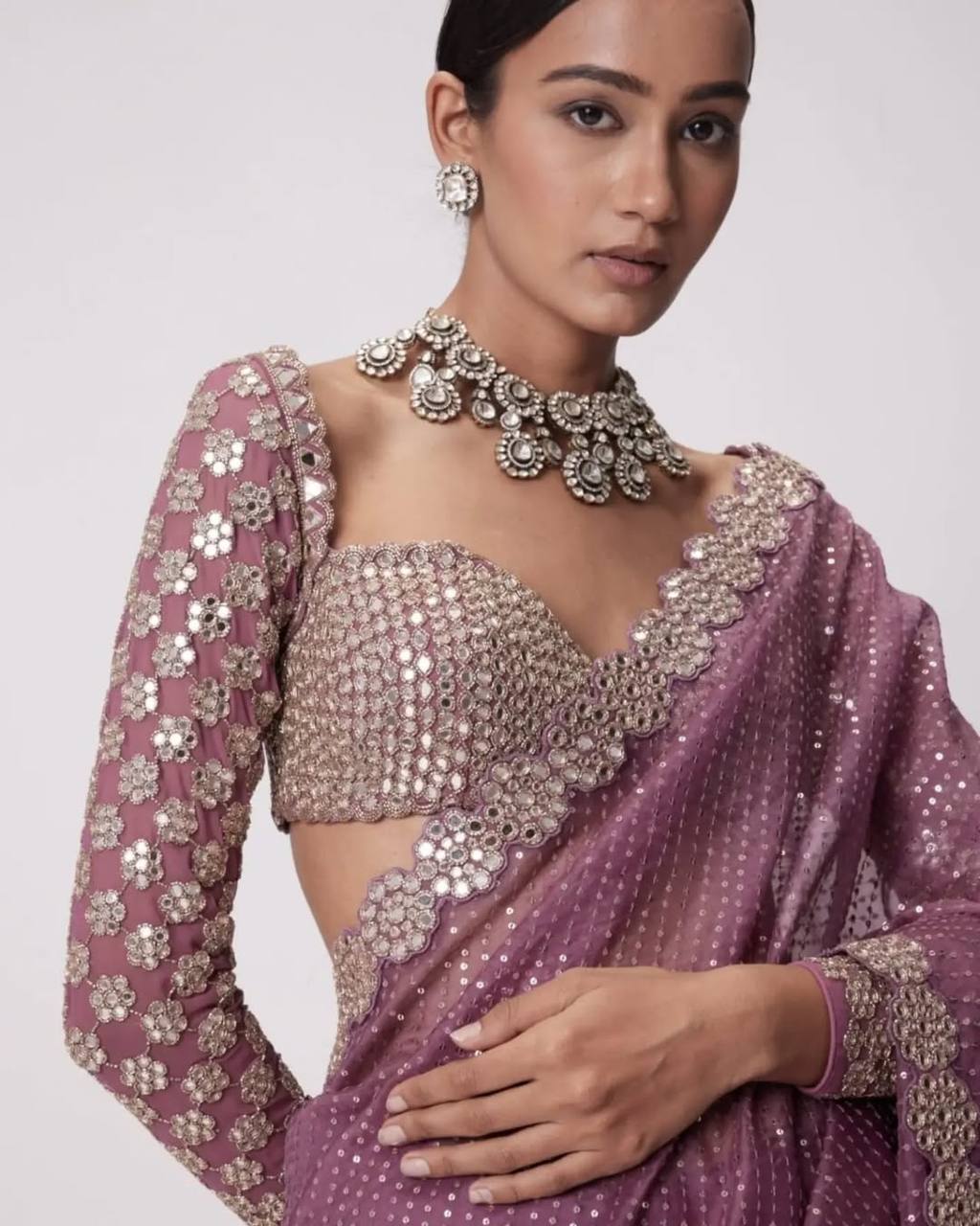 Faux Georgette Saree featuring a beautifully embroidered body adorned with sparkling 5mm sequins