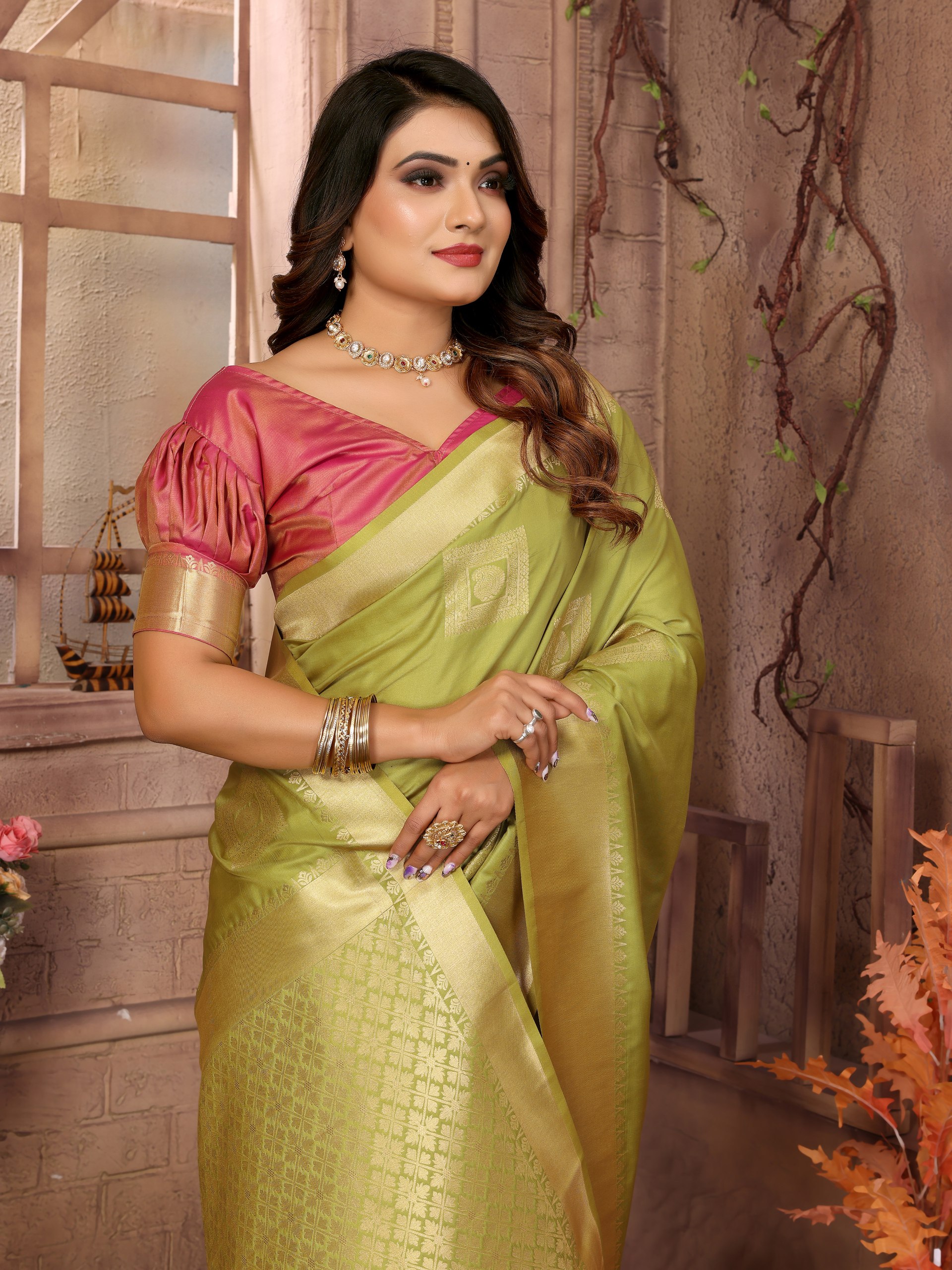 Soft Silk Saree featuring an elegant woven Butta motif embellishing the body